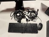 a keyboard, mouse, and other electronics on a table