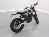 a motorcycle that is parked in a white room