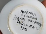 a white plate with writing on it in a person ' s hand