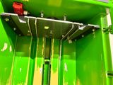 an image of a green metal box with a red light