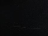 a cat that is sitting on a table in the dark