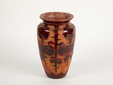 a vase that is sitting on a white surface