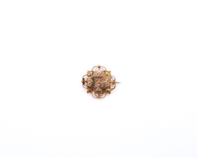 a close up of a ring with a flower design on it
