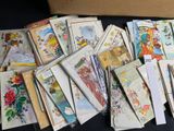 many cards and envelopes laid out on a table