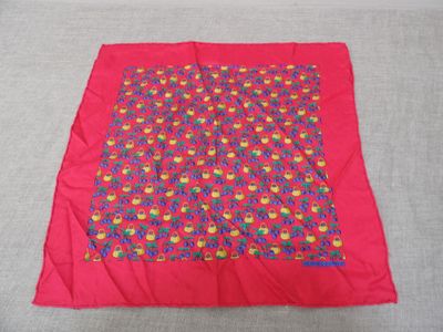 a close up of a red blanket with a pattern on it