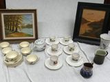a lot of cups and saucers on a table
