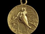 une image représentant une médaille d'or sur laquelle figure un oiseau