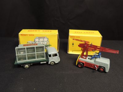 two toy trucks that are sitting next to each other