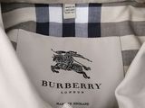 the label on a white shirt that says burberry london