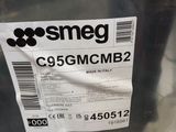 a plastic container with a label on it that says smeg