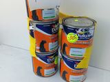 two cans of paint sitting next to each other on a table