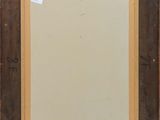 an old picture frame with a brown border and a white background