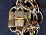 a gold chain with a padlock attached to it