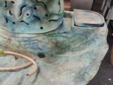 a statue of a dog sitting on top of a table