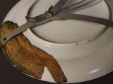 a plate with a spoon and a fork on it