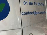 a van that has a sign on the side of it
