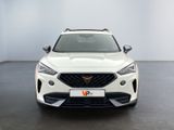 the front view of a white suv parked in a showroom