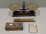 a scale that is sitting on a table next to other items