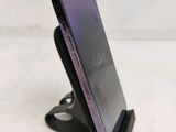 a cell phone that is sitting on top of a stand