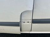 a white van with a black stripe on the side of it