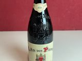 a bottle of wine that is sitting on a table