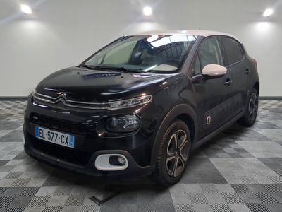 the black citrole is parked in the garage on a checkered floor