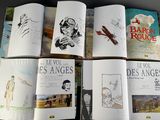 several pages of a book with drawings of people on them