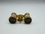 an image of a pair of binoculars sitting on top of a table