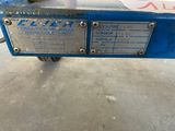 an image of a close up of the back end of a blue machine