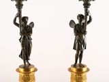 pair of antique bronze candlesticks with angels and flowers on them