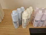 many different types of hair products sitting on a table