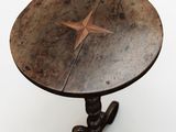 a wooden table with a star on top of it