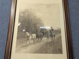 photo encadrée représentant une calèche tirée par des chevaux sur un chemin de terre