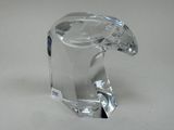 a clear glass animal figurine sitting on a table