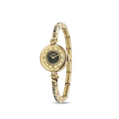 une montre en or avec un cadran noir et un bracelet en or