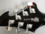 a close up of a black electric guitar on a white background