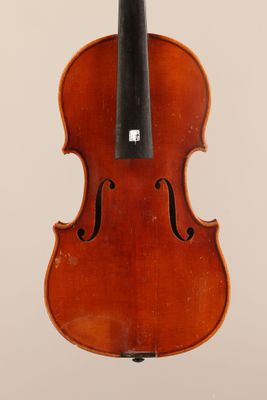 an old violin with a bow hanging from it ' s back