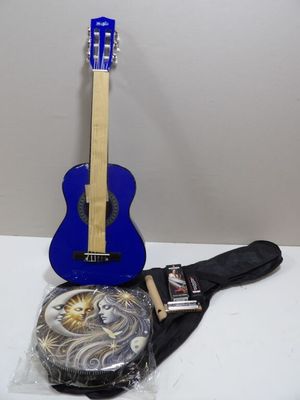 blue guitar with a case and a guitar strap sitting on a table