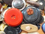 many different types of buttons on the table together