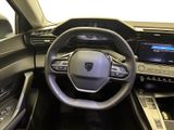 the interior of a car with a steering wheel and dashboard controls