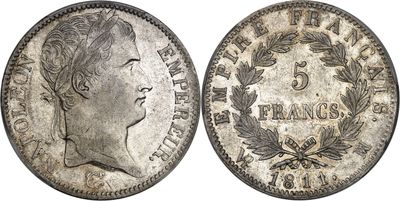a silver coin with a woman ' s face on it