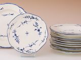 a stack of plates with blue and white designs on them