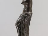 an image of a statue of a woman sitting on a pedestal