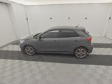 a picture of a car in a garage with a checkered floor