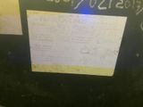a picture of a sign on the side of a machine