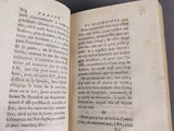 an open book with a page of text on it sitting on a table