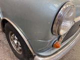 a close up of a car ' s headlight and front bumper