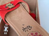 a box with a pair of sandals inside of it