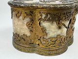 a gold and white box with a bird on it
