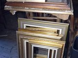 a lot of picture frames stacked on top of each other